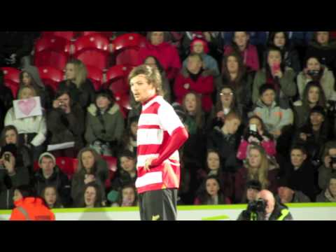 One Direction's Louis Tomlinson makes his football debut for Doncaster Rovers