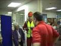 Fall arrest harness being put onto mannequin man by member of the public at a Safety clothing and PPE exhibition by ARCO at family open day at BAE (British Aerospace Engineering) systems in Rochester #2 (flash) Fall arrest harness being put onto mannequin man by member of the public at a Safety clothing and PPE exhibition by ARCO at family open day at BAE (British Aerospace Engineering) systems in Rochester #2 (flash)