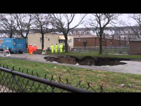 Raw: Storm Rips Open Chicago Sinkhole