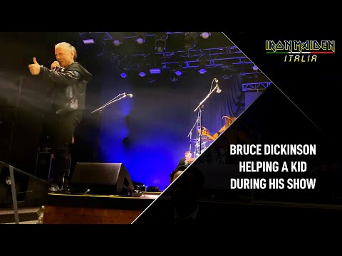 Bruce Dickinson helping a young fan during his show (2024)