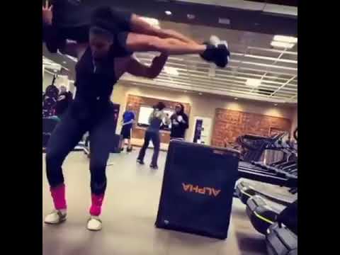 woman overhead lift man