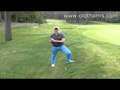 Chipping Up To The Green From A Steep Bank