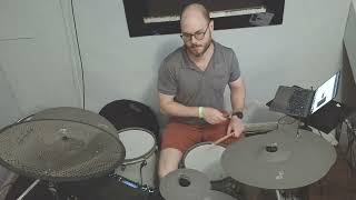 Ben playing his drum kit at home