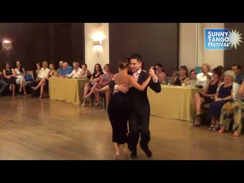  Lucas Gauto  and  Naima Gerasopoulou  are  dancing  to  a  milonga  at  Sunny Tango Festival  in  2018