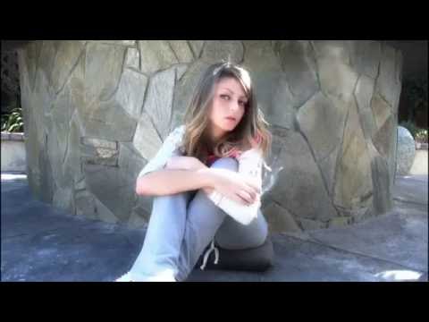 Cute girl smokes a cigarette in the sunshine ▶5:19