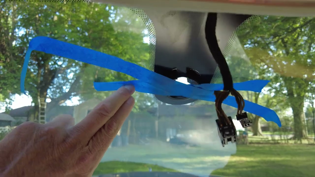 How to remove the rearview mirror from a Jaguar?