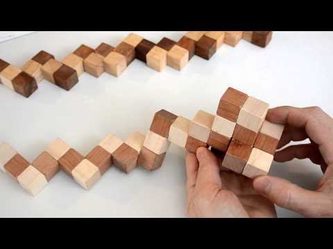 Part of a video titled How to solve the snake cube puzzle - YouTube