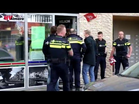 “Gewapende man in winkel Poseidonsingel”