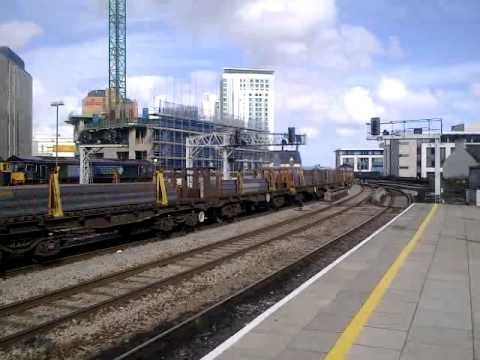 66060 passes Cardiff Central. bogie wagons + steel slabs 11/09/2010