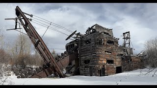 Exploring abandoned gold dredge and snowmobile riding