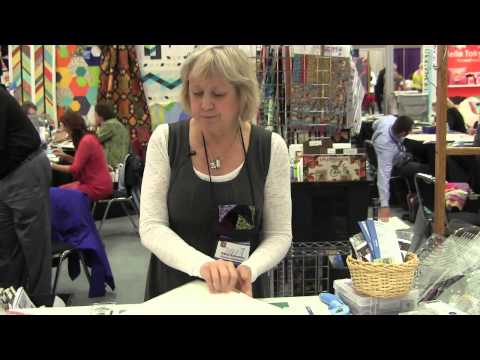 Karla Alexander Demonstrates Rulers at Checker Booth - Spring Quilt Market 2013