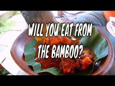 EAT WHAT LOCALS EAT IN UBUD, EATING FISH THAT IS COOK INSIDE BAMBOO AT