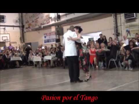  El Chino Perico  and  Malee Rodriguez  are  dancing  to  the  tango  "  Marion  "