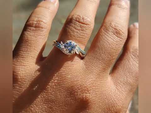 Bypass engagement ring with 1ct natural white diamond and blue diamonds accent