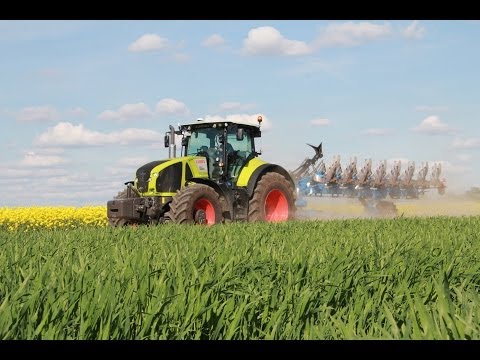 Claas Axion 920 Traktor mit Rabe Kormoran Pflug