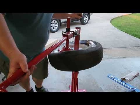 Harbor Freight manual tire changer with duckbill attachment. Mounting a trailer tire.