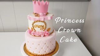 Two tier Baby Shower Cake with a crown cake topper