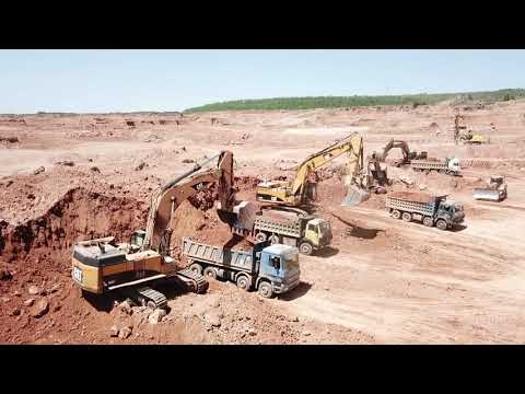Caterpillar 365C And Caterpillar 245 Excavators Loading Trucks