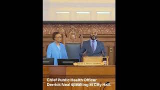 Chief Public Health Officer Derrick Neal speaking at City Hall.