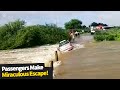 Passengers make miraculous escape after their car is swept away by flash floods.
