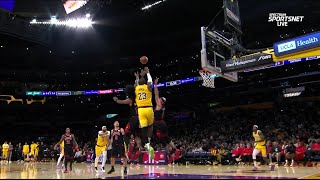 LeBron James flies into the sky to catch the ball and make an assist vs Bulls