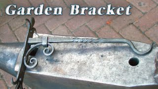 Blacksmithing - Forging a garden bracket of three railroad spikes!