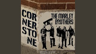 Kadr z teledysku Cornerstone tekst piosenki The Marley Brothers