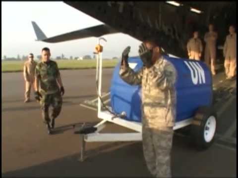U.S. and Rwandan Defense Forces Loads Cargo Into C-17 Aircraft