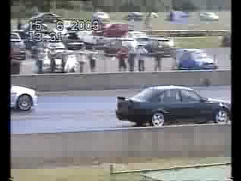 BMW M3 Vs Vauxhall Lotus Carlton Drag Race at Santa Pod