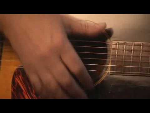 Mark Knopfler Showing his magic on an acoustic guitar