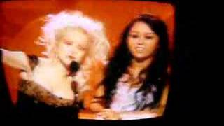 Miley presenting an award at the grammys with cyndi lauper