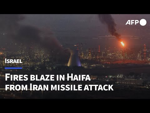 Fires blaze in Haifa following Iran missile attack | AFP