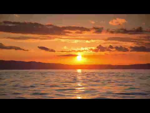 Stunning orange sunset seen from the sea.