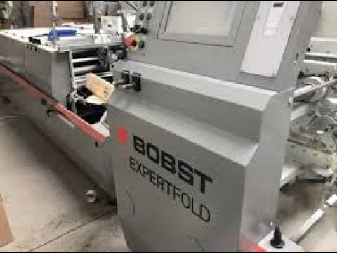 BOBST Folder Gluer EXPERTFOLD producing 4-corner boxes @ 29,000 boxes per hr.