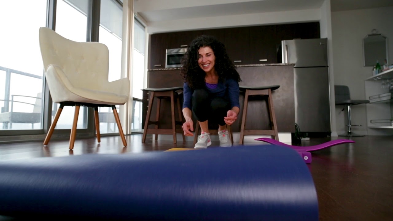 No Copyright Stock Videos - Woman rolling out a yoga mat