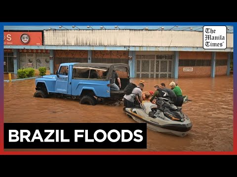 Brazilian volunteers rush to rescue people stranded by deadly floods