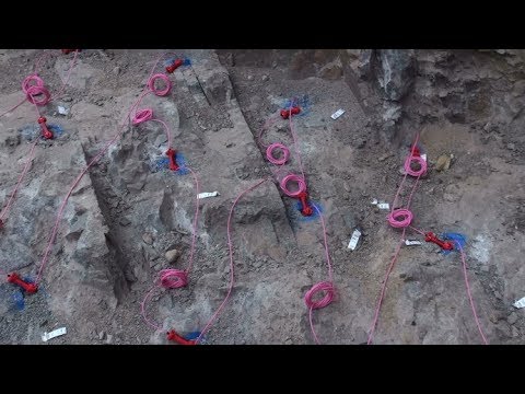 Blasting retaining wall footings in hard rock in Tecoma
