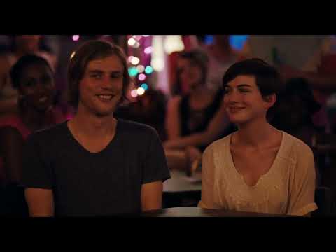 Trailer still: dim club stage as a hush falls over the crowd before a Johnny Flynn song