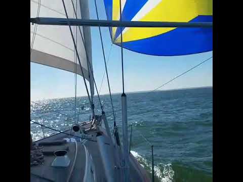 Sailing Tenacious Hallberg Rassy 53 downwind two head sails wing and wing to Sandy Hook