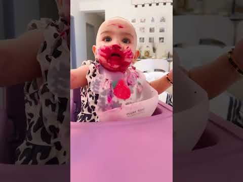 Cute baby eating dragon fruit