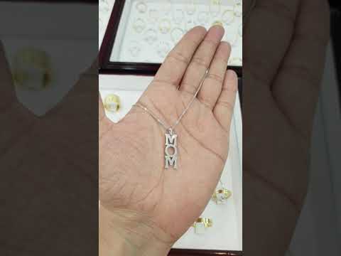 A video of 14k Gold Diamond Mom Pendant