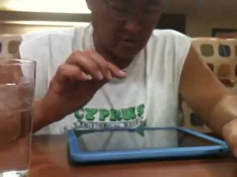 Dad playing duck hunt on iPad