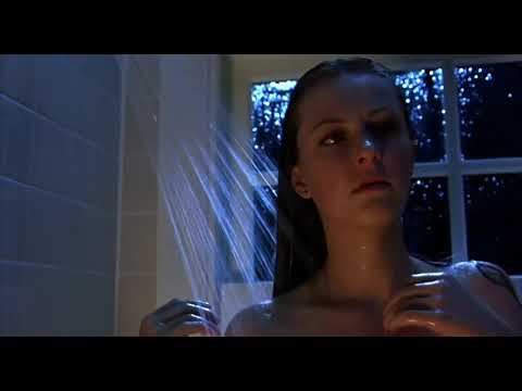 Freddy vs. Jason (2003) official trailer frame with Freddy’s glove and Jason’s machete, setting a heavy-metal tone