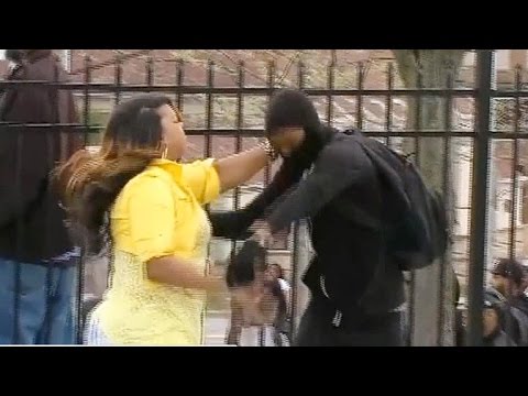 Angry mom grabs son off street amid Baltimore riot