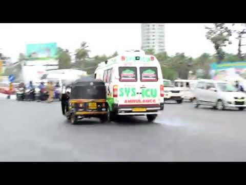 Ambulance rams bike riders at traffic signal