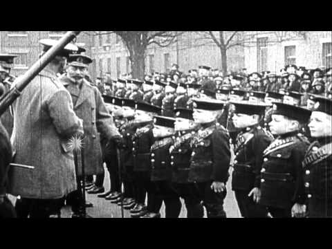 King George V and other officials review boys in formation of young boy cadets at...HD Stock Footage