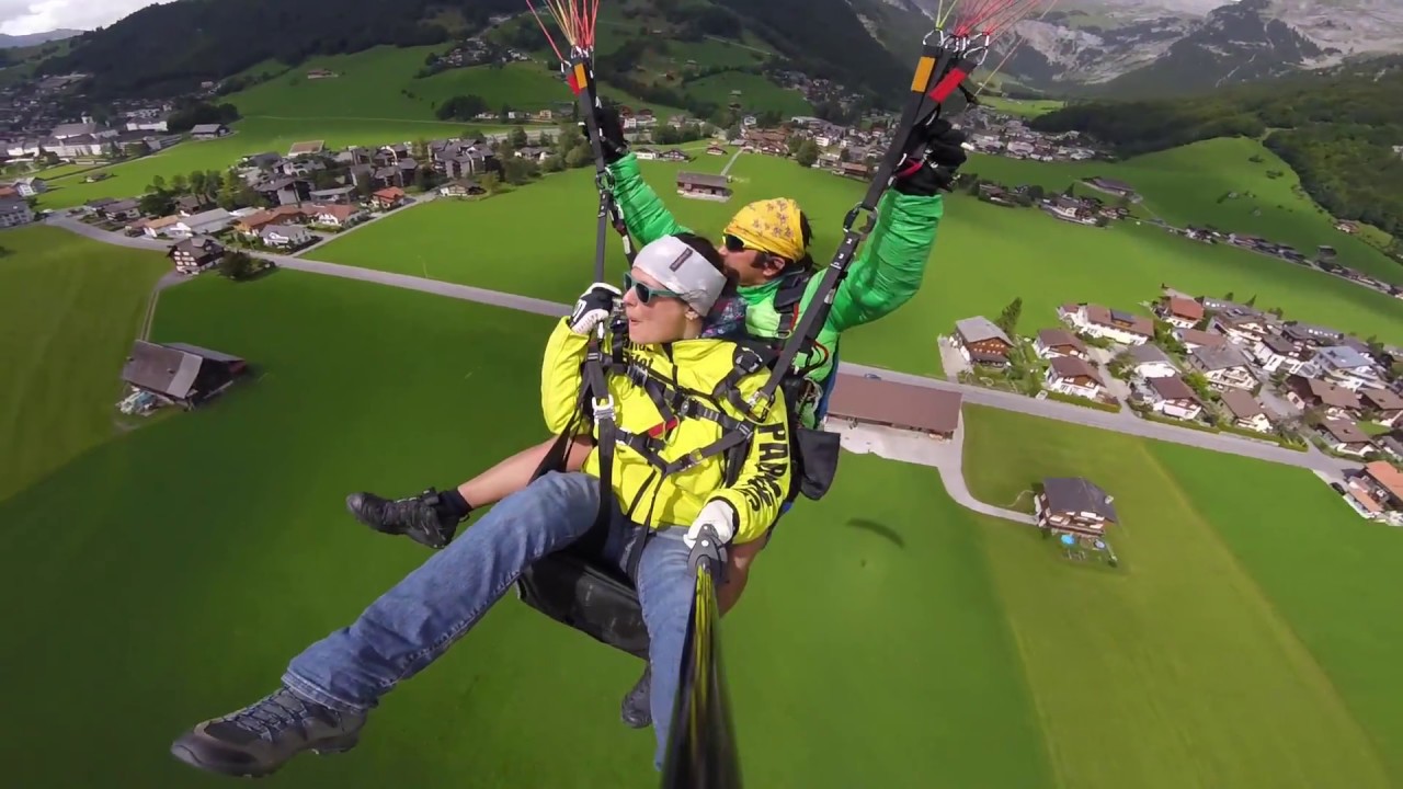 Soar above Engelberg’s alpine peaks with a thrilling tandem paragliding flight.