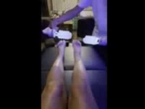 Using a TZLA machine on the wife's legs and feet 