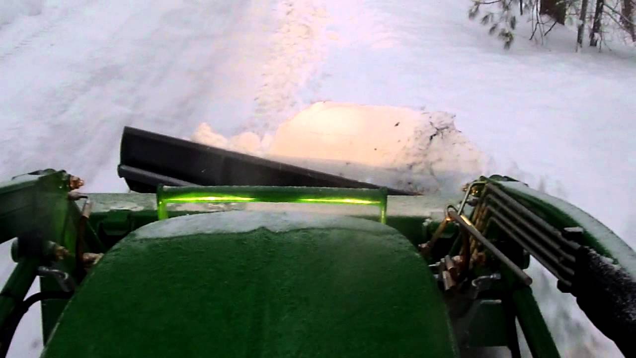 Snow plowing with clamp-on bucket plow