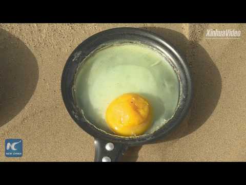 Frying an egg in Taklamakan Desert in Xinjiang, China